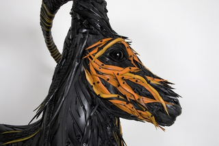 Illustration for article titled This Artist Turns Old Tires Into Dark, Disturbing Nightmare Monsters